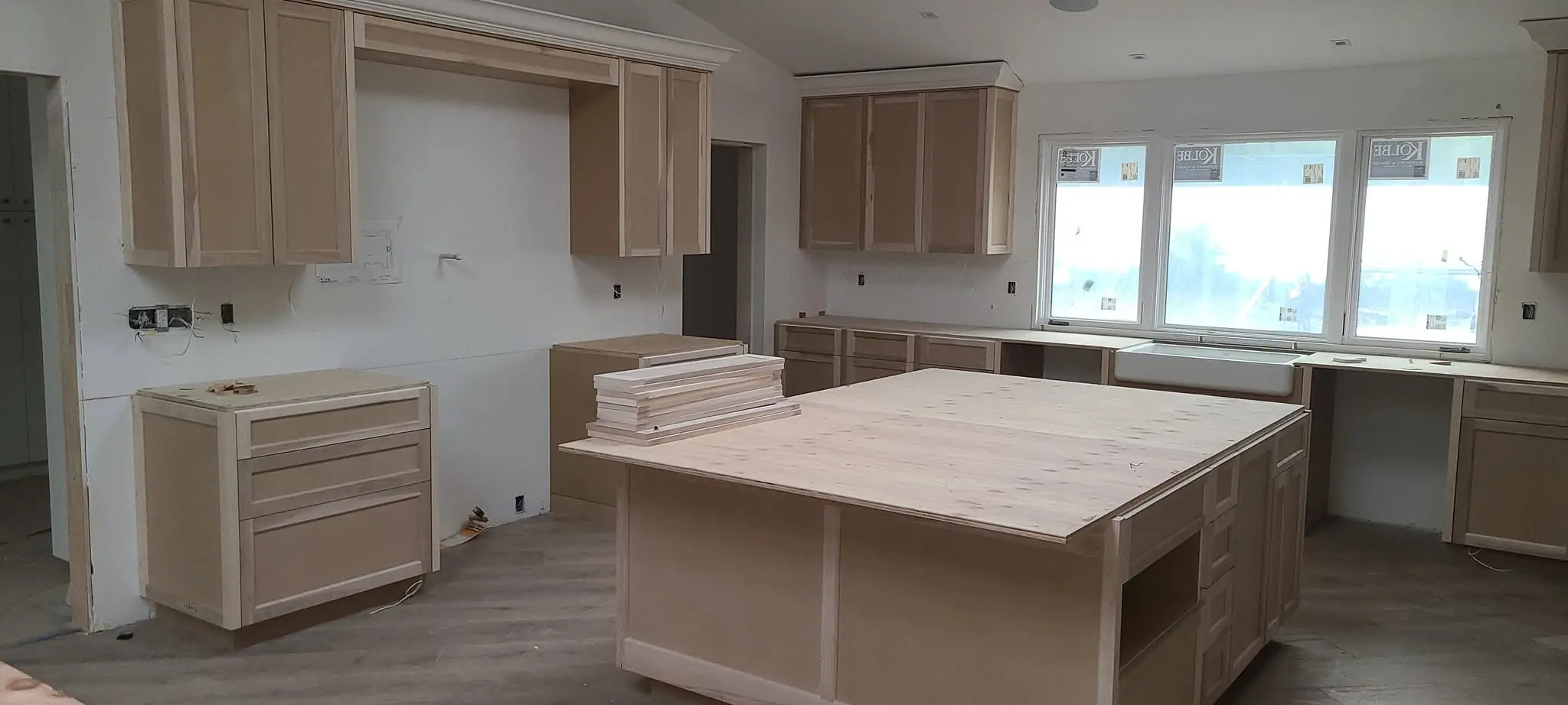 Kitchen cabinet boxes primed and ready for a sprayed lacquer finish